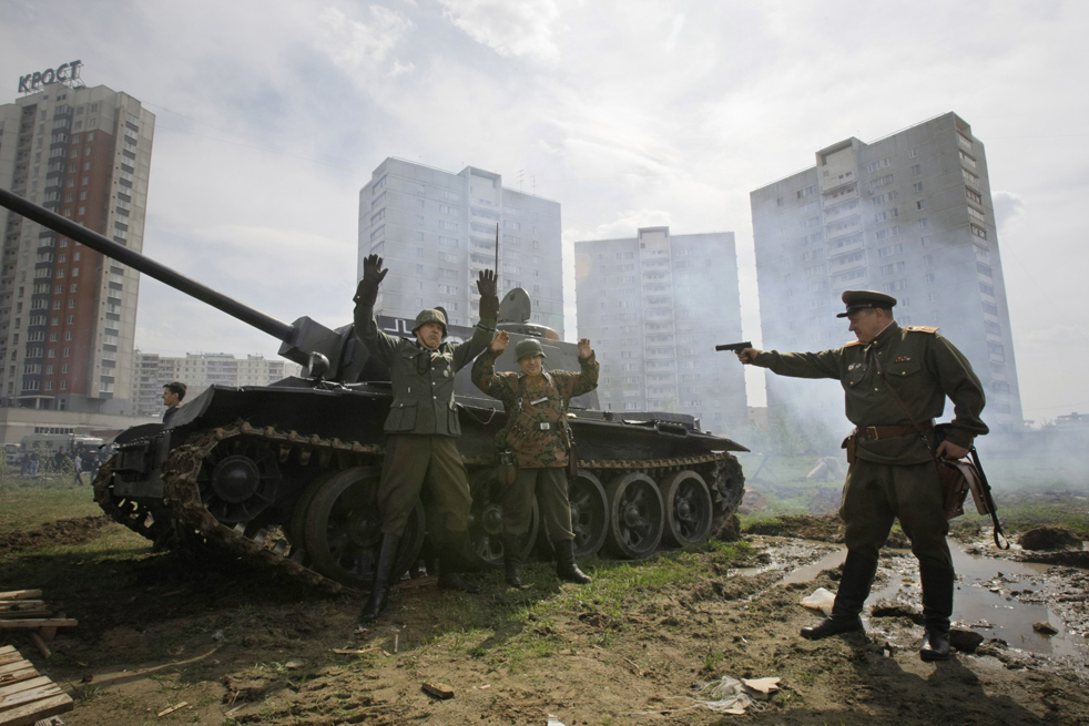 Russian enthusiasts reenact historic battles against a World War II tank on the outskirts of Moscow Wednesday May 5 2010. AP Ivan Sekretarev  : 10 